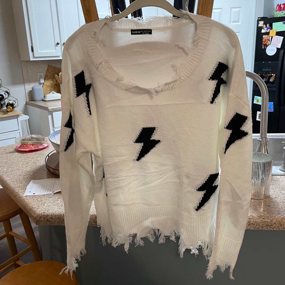White sweater with lightening bolt detail